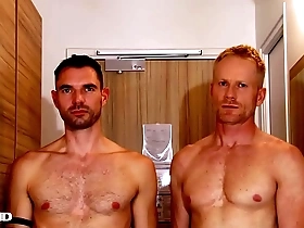 Handsome blonde fitness trainer serviced by a huge dick guy.