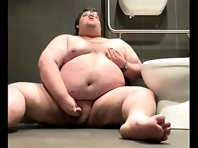 Chubby plays in public bathroom